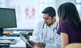 A picture depicting a doctor discussing results with patien